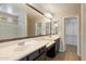 Elegant bathroom offers dual sinks and a wide mirror to complement the space at 737 E Harwell Rd, Phoenix, AZ 85042