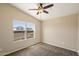 Comfortable bedroom with a ceiling fan and a window view of neighborhood at 737 E Harwell Rd, Phoenix, AZ 85042
