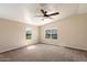 Spacious bedroom with neutral tones, large windows, and plush carpeting, offering a serene retreat at 737 E Harwell Rd, Phoenix, AZ 85042