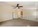 Upstairs loft area with a ceiling fan, neutral carpeting, and ample space for relaxation or recreation at 737 E Harwell Rd, Phoenix, AZ 85042