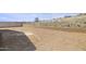 Large unfinished backyard with block wall and metal fence at 7428 W Buckhorn Trl, Peoria, AZ 85383