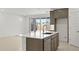 Kitchen island with sink and stainless steel dishwasher and appliances at 7428 W Buckhorn Trl, Peoria, AZ 85383