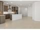 Open kitchen with stainless steel appliances, island, and modern cabinetry at 7428 W Buckhorn Trl, Peoria, AZ 85383