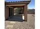 Inviting covered back patio perfect for entertaining or relaxing outdoors with an easy to maintain rock yard at 7551 W Darrel Rd, Laveen, AZ 85339