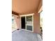 Covered back patio with sliding glass door entry to the interior at 7551 W Darrel Rd, Laveen, AZ 85339