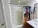 Bright bathroom featuring a tub-shower combo and horse-themed shower curtain at 7551 W Darrel Rd, Laveen, AZ 85339