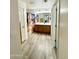 Hallway view of a bathroom featuring a double sink vanity and a horse-themed shower curtain at 7551 W Darrel Rd, Laveen, AZ 85339