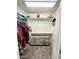 Walk-in closet featuring a built-in dresser, shelving, and ample storage at 7551 W Darrel Rd, Laveen, AZ 85339