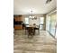 Dining area with wood-look flooring and a sliding glass door providing backyard access at 7551 W Darrel Rd, Laveen, AZ 85339
