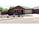 Lovely single-story home with a two-car garage, low-maintenance desert landscaping, and inviting curb appeal at 7551 W Darrel Rd, Laveen, AZ 85339