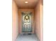 Front door features a charming wreath, providing a warm and inviting entry at 7551 W Darrel Rd, Laveen, AZ 85339