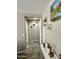 A hallway with wood flooring, decorative wall art and sculptures at 7551 W Darrel Rd, Laveen, AZ 85339
