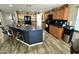 Kitchen island with breakfast bar seating and a sink at 7551 W Darrel Rd, Laveen, AZ 85339