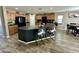 Open concept kitchen featuring a large island, wooden cabinets, and modern appliances at 7551 W Darrel Rd, Laveen, AZ 85339