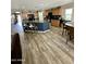 Open concept kitchen featuring a large island, wooden cabinets, and modern appliances at 7551 W Darrel Rd, Laveen, AZ 85339