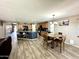Bright kitchen with a center island, dining area, and wood-look flooring at 7551 W Darrel Rd, Laveen, AZ 85339