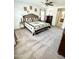 View of main bedroom leading into en suite bath and a cozy and inviting interior at 7551 W Darrel Rd, Laveen, AZ 85339