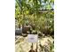 A peach tree grows near the house with a white sign for identification at 7551 W Darrel Rd, Laveen, AZ 85339
