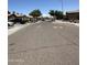 Wide street showcasing well-kept homes and landscaping on a sunny day at 7551 W Darrel Rd, Laveen, AZ 85339