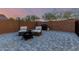 Cozy backyard oasis featuring a stylish fire pit, grill, comfortable seating, and paved patio for outdoor relaxation at 7829 W Warner St, Phoenix, AZ 85043