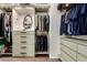 Organized walk-in closet features custom shelving, drawers, and ample hanging space at 7829 W Warner St, Phoenix, AZ 85043