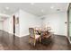 Well-lit dining room featuring a wood table with seating for six, perfect for Gathering meals and entertaining at 7829 W Warner St, Phoenix, AZ 85043