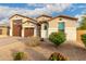 Attractive single-Gathering home showing well maintained landscaping and a spacious three-car garage at 7829 W Warner St, Phoenix, AZ 85043