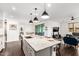 The spacious kitchen features a large island with seating, perfect for casual dining and entertaining at 7829 W Warner St, Phoenix, AZ 85043