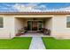 Covered outdoor patio with an outdoor ceiling fan and sliding glass doors at 7829 W Warner St, Phoenix, AZ 85043