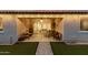 Inviting covered patio with ample seating, ceiling fan, and sliding glass doors for seamless indoor-outdoor living at 7829 W Warner St, Phoenix, AZ 85043