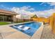 Inviting pool area with a white umbrella, lounge chairs, and a clean, clear pool at 7829 W Warner St, Phoenix, AZ 85043
