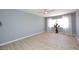Bright bedroom featuring light wood floors, a ceiling fan and a vase with flowers at 7920 E Camelback Rd # 612, Scottsdale, AZ 85251