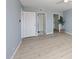 Bright bedroom featuring light wood floors, light blue walls and a walk-in closet at 7920 E Camelback Rd # 612, Scottsdale, AZ 85251