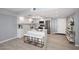 Eat-in kitchen featuring white cabinets, stainless steel appliances, and an island with seating at 7920 E Camelback Rd # 612, Scottsdale, AZ 85251