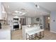 Charming kitchen features a center island, stainless steel appliances, and stylish lighting at 7920 E Camelback Rd # 612, Scottsdale, AZ 85251