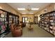 Community library featuring extensive bookshelves and comfy seating, offering a quiet retreat for residents at 7920 E Camelback Rd # 612, Scottsdale, AZ 85251