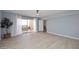 Bright living room featuring wood floors, a ceiling fan, and a sliding glass door to a balcony at 7920 E Camelback Rd # 612, Scottsdale, AZ 85251