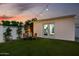 Backyard with artificial turf, flex space, and ambient lighting, perfect for outdoor activities at 8021 N 16Th Dr, Phoenix, AZ 85021