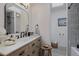 Bathroom featuring wooden vanity, modern fixtures, and skylight at 8021 N 16Th Dr, Phoenix, AZ 85021