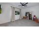 Bright bedroom with a ceiling fan, large windows and a clothing rack for additional storage at 8021 N 16Th Dr, Phoenix, AZ 85021