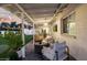 Comfortable covered patio with ample seating, string lights, and views of the backyard at 8021 N 16Th Dr, Phoenix, AZ 85021