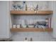 Close-up of kitchen shelving with decorative dishware and stylish accents at 8021 N 16Th Dr, Phoenix, AZ 85021