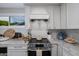 Modern kitchen featuring marble countertops, stainless steel appliances and ample natural light at 8021 N 16Th Dr, Phoenix, AZ 85021