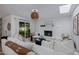 Cozy living room features a white brick fireplace, comfortable seating, and natural light at 8021 N 16Th Dr, Phoenix, AZ 85021