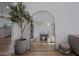 Stylish interior view showcases an elegant arched mirror and chic decor at 8021 N 16Th Dr, Phoenix, AZ 85021