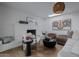 Living room featuring a white brick fireplace, comfortable seating, and stylish decor at 8021 N 16Th Dr, Phoenix, AZ 85021