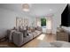 Inviting living room with comfortable seating, hardwood floors, soft natural light, and stylish decor elements at 8021 N 16Th Dr, Phoenix, AZ 85021