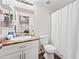 Well-lit bathroom featuring a vanity with granite countertops and a shower with white shower curtain at 930 N Mesa Dr # 1079, Mesa, AZ 85201