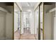 Bathroom access through mirrored closet doors with white cabinets and plenty of space at 930 N Mesa Dr # 1079, Mesa, AZ 85201