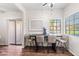 Bright dining area with a modern table, seating for four, and ample natural light at 930 N Mesa Dr # 1079, Mesa, AZ 85201